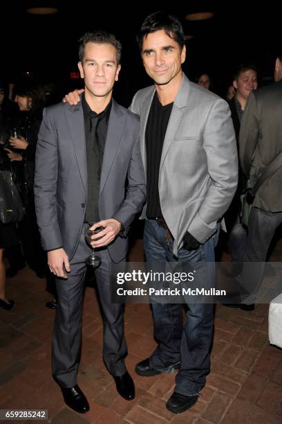 Josh Reed and John Stamos attend CALVIN KLEIN COLLECTION Women's Spring 2010 After-Party at The Standard on September 17, 2009 in New York.