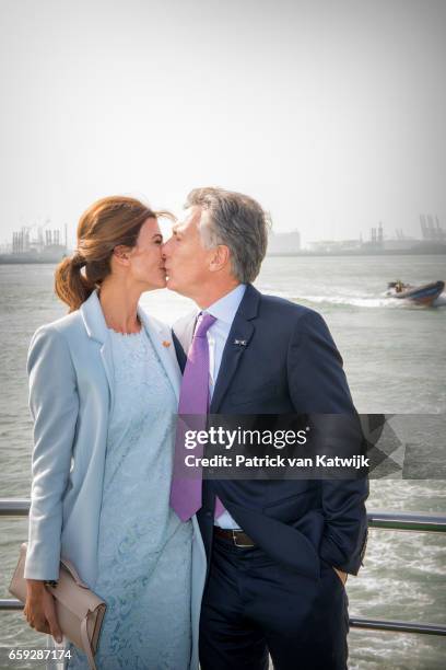 President Mauricio Macri and his wife Juliana Awada of Argentina kissing each other during an boat trip in the harbor of Rotterdam on March 28, 2017...