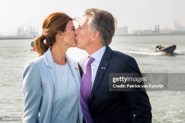 President Mauricio Macri and his wife Juliana Awada of Argentina kissing each other during an boat trip in the harbor of Rotterdam on March 28, 2017...