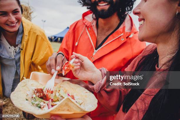 enjoying the food at a music festival - flatbread stock pictures, royalty-free photos & images