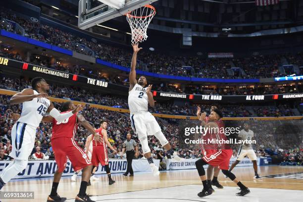 Kris Jenkins of the Villanova Wildcats drives to the basket during the Second Round of the NCAA Basketball Tournament against the Wisconsin Badgers...