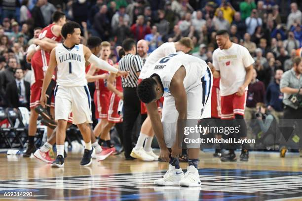 Kris Jenkins of the Villanova Wildcats reacts to the lass after the Second Round of the NCAA Basketball Tournament against the Wisconsin Badgers at...