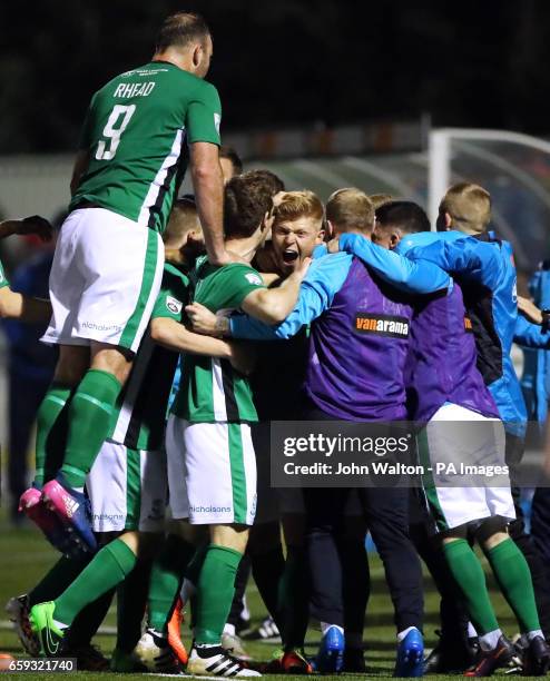 Lincoln City's Elliott Whitehouse celebrates scoring his side's first goal of the game with team-mates during the Vanarama National League match at...