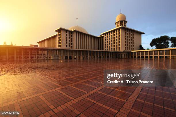 sunset, istiqlal mosque, jakarta landmark - istiqlal stock pictures, royalty-free photos & images