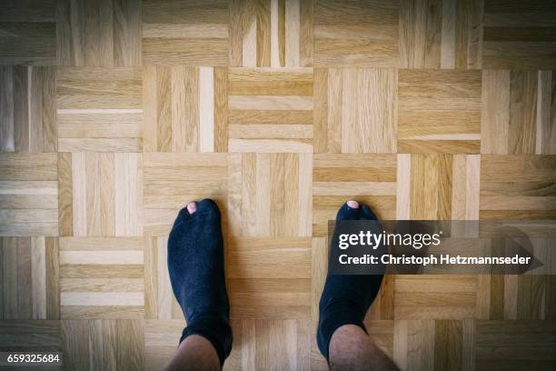 hole in socks - black men feet stock-fotos und bilder