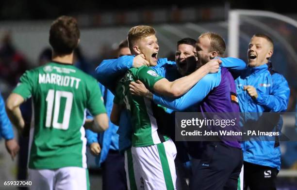 Lincoln City's Elliott Whitehouse celebrates scoring his side's first goal of the game with team-mates during the Vanarama National League match at...