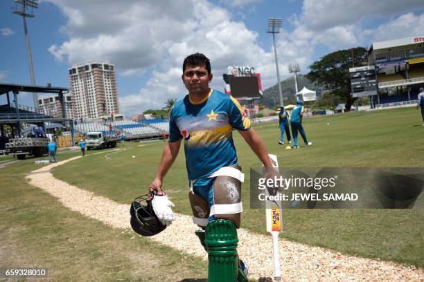 Pakistan's Kamran Akmal heads to the net to bat during a practice session at the Queen's Park Oval in Port of Spain, Trinidad, on March 28, 2017....