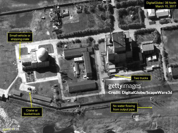 Figure 3. Two trucks seen near the 5 MWe Reactor. Mandatory credit for all images: DigitalGlobe via Getty Images/38 North via Getty Images