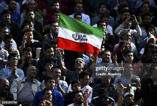 Supporters cheer for Iran team before the 2018 FIFA World Cup Qualifying group match between Iran and China at Azadi Stadium on March 28, 2017 in...