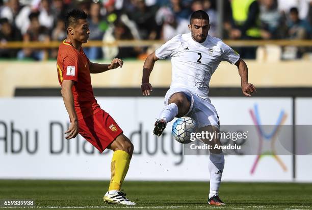 Milad Mohammadi of Iran in action against Yu Dabao of China during the 2018 FIFA World Cup Qualifying group match between Iran and China at Azadi...