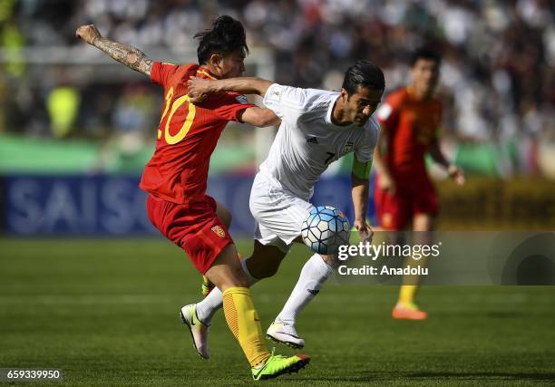 Masoud Shojaei of Iran in action against Zhang Xizhe of China during the 2018 FIFA World Cup Qualifying group match between Iran and China at Azadi...