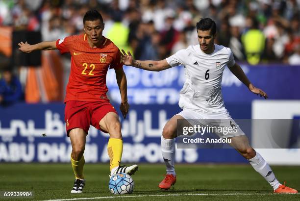 Saeid Ezatolahi of Iran in action against Yu Dabao of China during the 2018 FIFA World Cup Qualifying group match between Iran and China at Azadi...