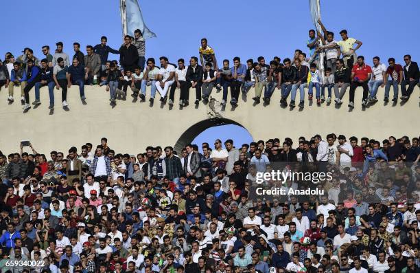 Supporters cheer for Iran team before the 2018 FIFA World Cup Qualifying group match between Iran and China at Azadi Stadium on March 28, 2017 in...