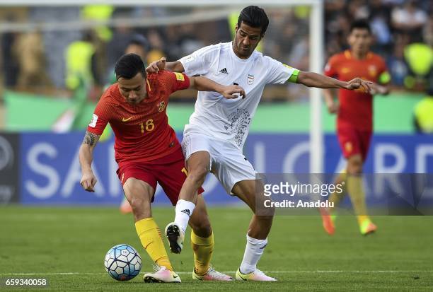Masoud Shojaei of Iran in action against Gao Lin of China during the 2018 FIFA World Cup Qualifying group match between Iran and China at Azadi...