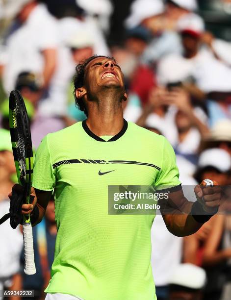 Rafael Nadal of Spain celebrates match point against Nicolas Mahut of France during Day 9 of the Miami Open at Crandon Park Tennis Center on March...