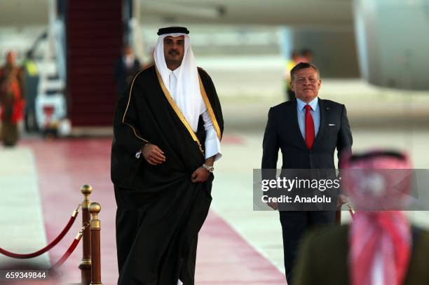 Emir of Qatar, Tamim bin Hamad Al Thani is welcomed by Jordan's King Abdullah II with an official ceremony at Queen Alia International Airport, as...