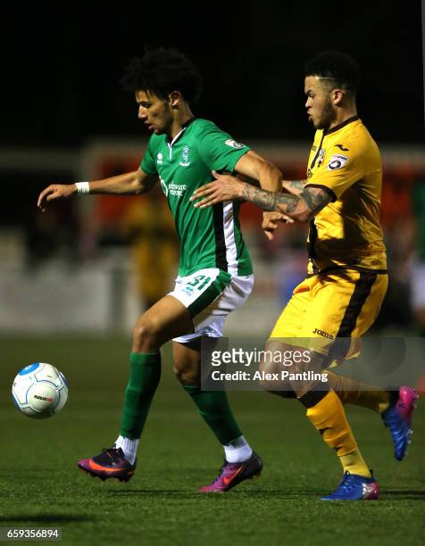 Lee Angol of Lincoln City holds off Louis John of Sutton united during the Vanarama National League match between Sutton United and Lincoln City at...