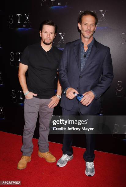 Actor Mark Wahlberg and director Peter Berg at CinemaCon 2017 The State of the Industry: Past, Present and Future and STX Films Presentation at The...