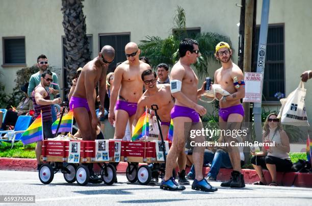 men in purple speedos at the 2012 long beach lesbian & gay pride - gay men swimwear photos et images de collection