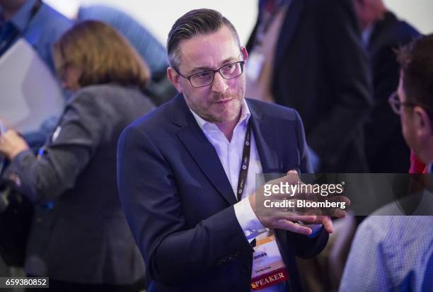 James Riley, chief strategy officer of Vertex, speaks with an attendee during the ETS17 conference in Austin, Texas, U.S., on Tuesday, March 28,...