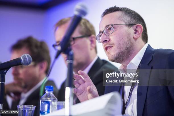 James Riley, chief strategy officer of Vertex, right, speaks during a panel discussion at the ETS17 conference in Austin, Texas, U.S., on Tuesday,...