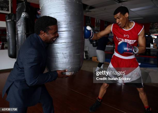 Michael 'Pinball' Clemons, Co-Founder of the Pinball Clemons Foundation, and Two-time Ontario Golden Gloves boxing champion Joshua Frazer attend the...