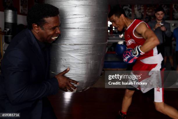 Michael 'Pinball' Clemons, Co-Founder of the Pinball Clemons Foundation, and Two-time Ontario Golden Gloves boxing champion Joshua Frazer attend the...