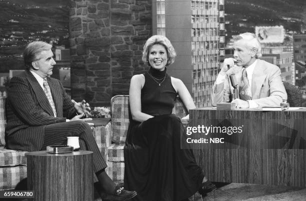 Pictured: Announcer Ed McMahon and Actress Leslie Easterbrook during an interview with Host Johnny Carson on May 19th, 1976--