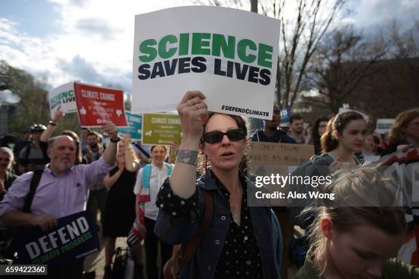 Holly Donaldson of Chattanooga, Tennessee, participates in a protest outside the White House March 28, 2017 in Washington, DC. Activists protest...