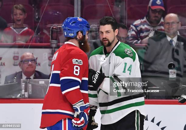 Jordie Benn of the Montreal Canadiens and Jamie Benn of the Dallas Stars exchange words prior the NHL game at the Bell Centre on March 28, 2017 in...