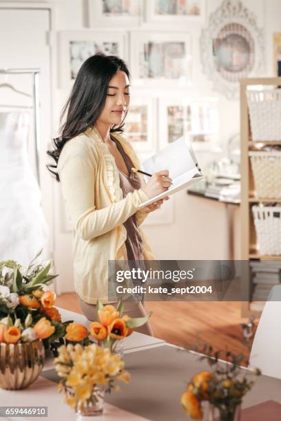 florist  working in her shop - event planner stock pictures, royalty-free photos & images