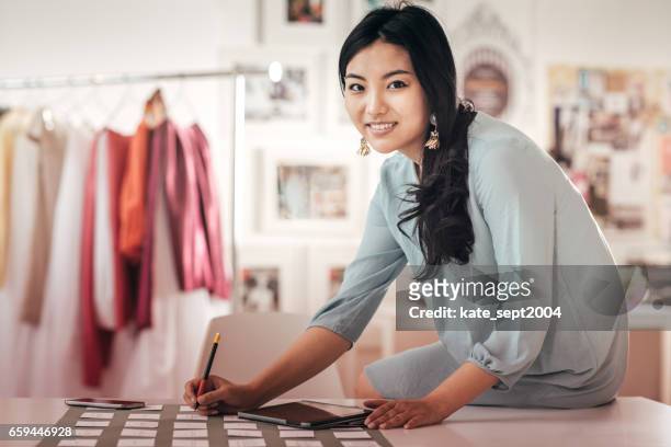 fashion designer in her studio - event planning stock pictures, royalty-free photos & images