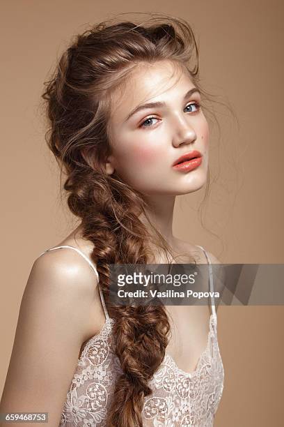 Young beautiful woman with braid
