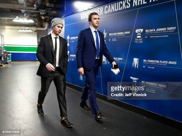 Nikolay Goldobin and Nikita Tryamkin of the Vancouver Canucks they walk to the team dressing room before their NHL game against the Anaheim Ducks at...