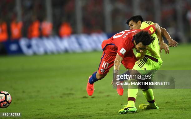 Venezuela's midfielder Renzo Zambrano vies for the ball with Chile's Jorge Valdivia during their 2018 FIFA World Cup qualifier football match in...