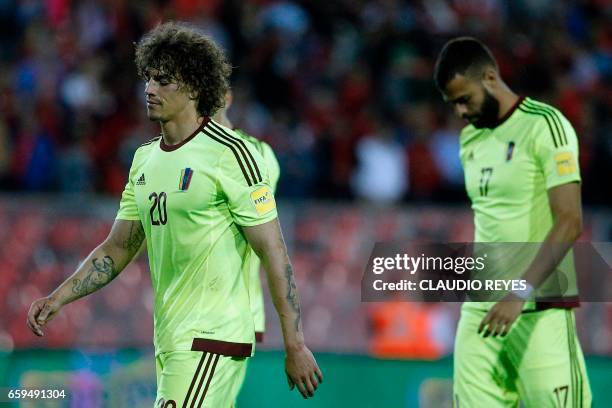 Venezuelan players leave the field after their 2018 FIFA World Cup qualifier football match against Chile in Santiago, Chile on March 28, 2017. The...