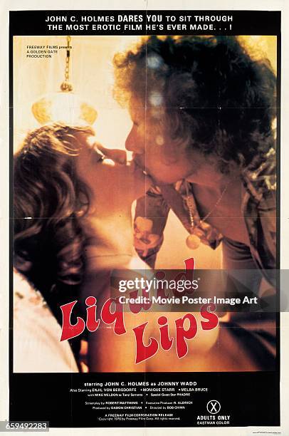 Image contains suggestive content.)A poster for the pornographic film 'Liquid Lips', starring actor John Holmes , 1976.