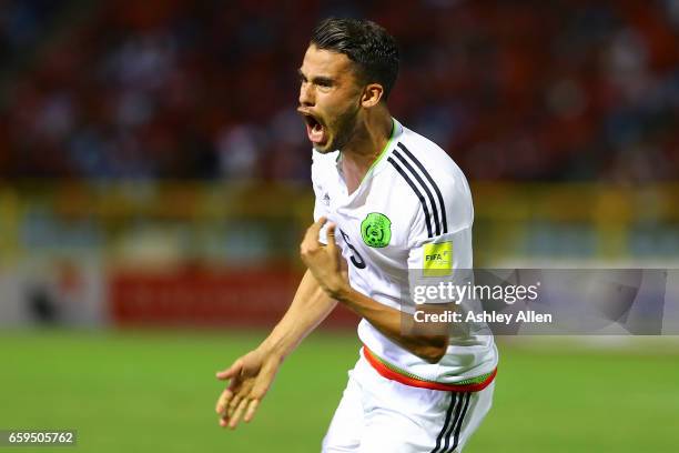 Diego Reyes of Mexico celebrates after scoring his team's first goal during the fifth round match between Trinidad & Tobago and Mexico as part of the...