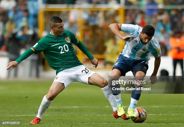 Mateo Musacchio of Argentina fights for the ball with Pablo Escobar of Bolivia during a match between Bolivia and Argentina as part of FIFA 2018...