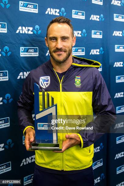 Captain Faf du Plessis of South Africa poses with the series trophy on day five of the Test match between New Zealand and South Africa at Seddon Park...