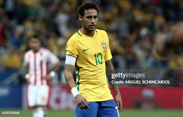 Brazil's forward Neymar gestures during their 2018 FIFA World Cup qualifier football match against Paraguay in Sao Paulo, Brazil on March 28, 2017. /...