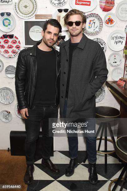 Theo Battaglia and model RJ King attend the Oliver Peoples Pour Berluti Launch Celebration at Sant Ambroeus SoHo on March 28, 2017 in New York City.