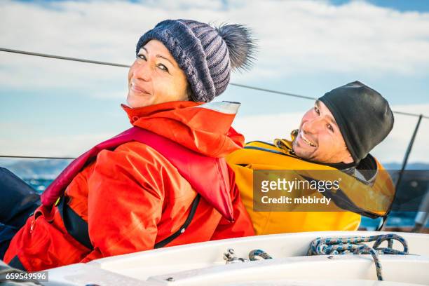 sailing crew on sailboat on regatta on sunny autumn morning - regatta stock pictures, royalty-free photos & images