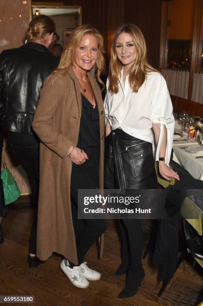 Founder of Paige Denim Paige Adams-Geller and Olivia Palermo attend the Oliver Peoples Pour Berluti Launch Celebration at Sant Ambroeus SoHo on March...