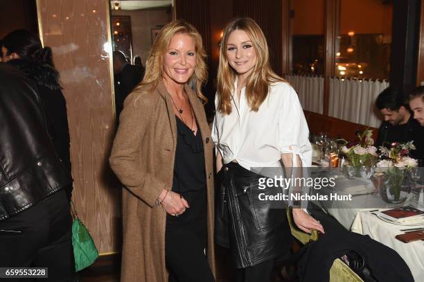 Founder of Paige Denim Paige Adams-Geller and Olivia Palermo attend the Oliver Peoples Pour Berluti Launch Celebration at Sant Ambroeus SoHo on March...