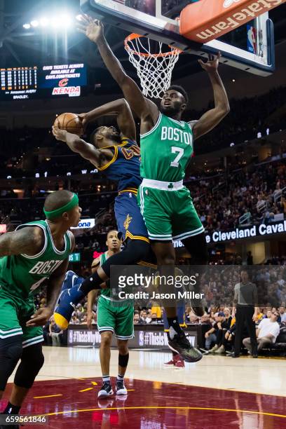 Tristan Thompson of the Cleveland Cavaliers shoots while Jaylen Brown of the Boston Celtics guards during the first half at Quicken Loans Arena on...