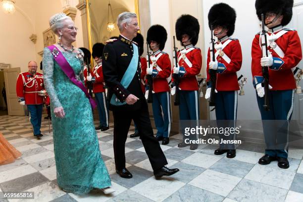 Queen Margrethe of Denmark and King Philippe of Belgium inspect the Royal Guard during arrival to the to the State Dinner on the occasion of the...