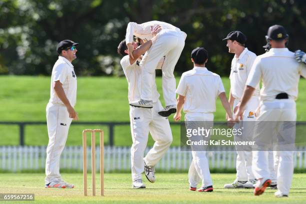 Hamish Bennett of Wellington is congratulated by Hamish Marshall of Wellington after dismissing Peter Fulton of Canterbury during the Plunket Shield...
