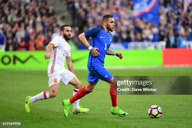 Layvin Kurzawa of France and Daniel Carvajal of Spain during the friendly match between France and Spain at Stade de France on March 28, 2017 in...