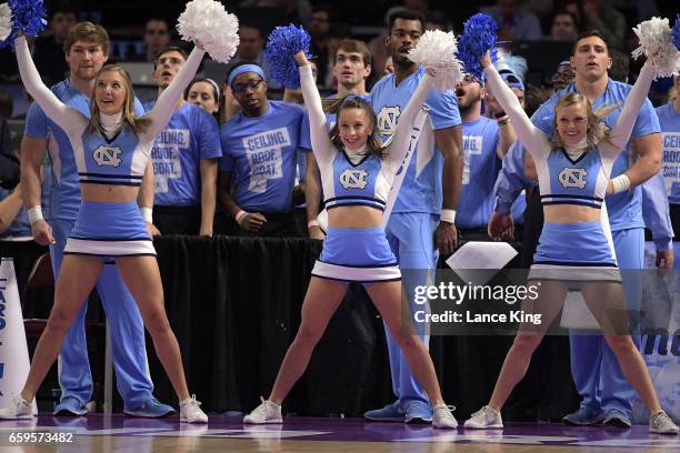 Cheerleaders of the North Carolina Tar Heels perform during the game against the Arkansas Razorbacks during the second round of the 2017 NCAA Men's...